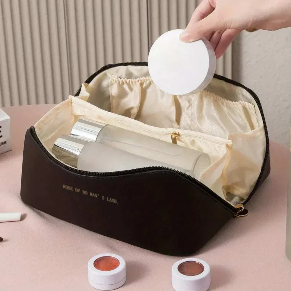 Stylish PU leather travel makeup bag with spacious interior and zipper closure for organizing beauty essentials on the go